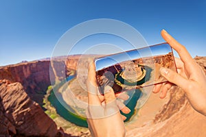 Taking photo of canyon horse shoe in USA Utah