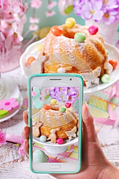 Taking photo of easter ring cake by smartphone