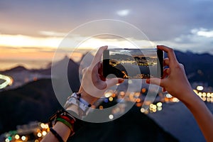 Taking a photo on a mobile phone camera of Rio de Janeiro, Brasil