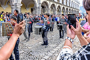 Taking photos of Independence Day parade, Antigua, Guatemala