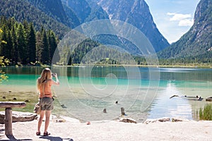 Taking photos at Lake Toblach, Tyrol photo