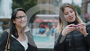 Taking photos at Trafalgar Square in London