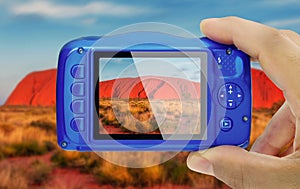 Taking picture ayers rock autralia compact camera display pov