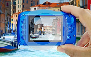 Taking picture venice canal italy compact camera display pov