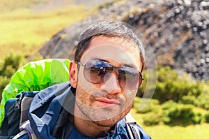 Happy hiker`s glasses reflecting photographer