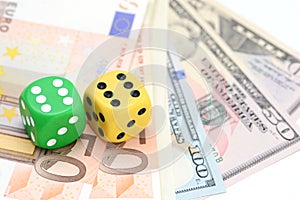 Taking a risk and winning concept with a pair of dice standing on US dollars