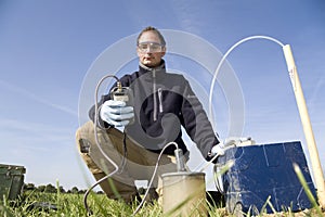 Taking samples of the soil and groundwater.