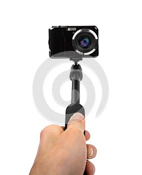 Taking selfie - hand hold monopod with photo camera