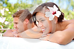 Taking time to pamper ourselves. Cute couple looking away during a spa day.