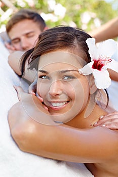 Taking time to treat ourselves. Pretty young woman receiving a massage with her boyfriend.