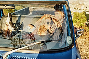 Taking a trip down lovers lane. a young couple out on a road trip with their truck.