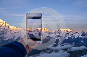 taking a vertical photo the third world\'s highest mountain Kangchenjunga 8586m during sunset time from the Mera Peak