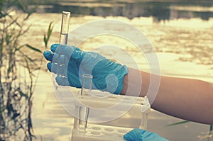 Taking a water test for analysis from a reservoir.