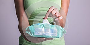 Taking wet wipes from the packaging - hygiene procedure and prevention of infectious diseases