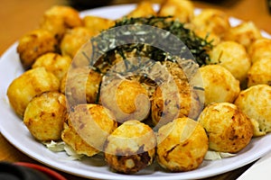 Takoyaki arranged on a plate in a Japanese restaurant