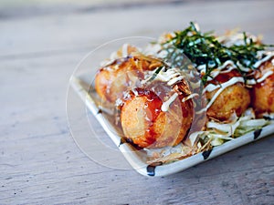 Takoyaki japanese food on wooden table