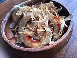 takoyaki in a wooden bowl