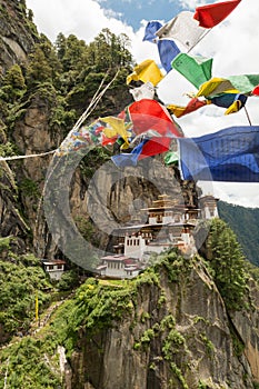 Taktsang Palphug Monastery with prayer flag (also known as The Tiger nest temple), Paro, Bhutan