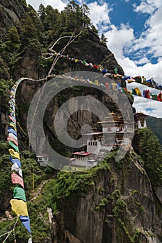 Taktsang Palphug Monastery with prayer flag (also known as The Tiger nest temple), Paro, Bhutan