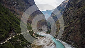 Tal - A panoramic view on a river flowing in a Himalayan valley