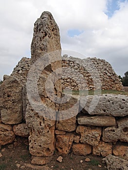 The Talaiotic village of Trepuco Minorca Balearic Islands showing a large megalith and taula in the background