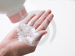 Talcum to Hand on white background photo