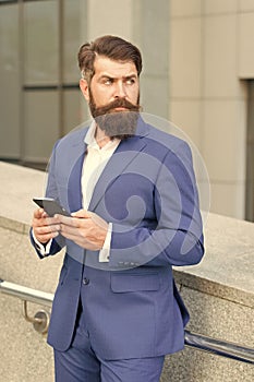 Talent of managing. Online business. Bearded man with smartphone. Businessman send sms using smartphone. Send message