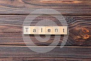 Talent word written on wood block. Talent text on cement table for your desing, concept