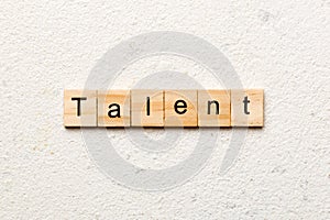 Talent word written on wood block. Talent text on cement table for your desing, concept