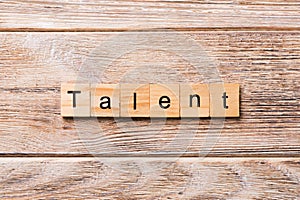 Talent word written on wood block. Talent text on wooden table for your desing, concept