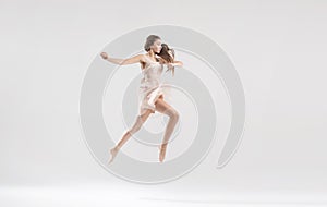 Talented ballet dancer in athletic jump