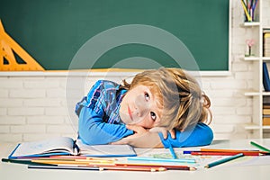 Talented child. Teachers day. School kids. Back to school. Kid is learning in class on background of blackboard.