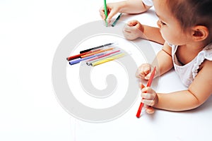 Talented children draw with colored felt-tip pens on white paper, lessons, tasks with children of the different ages