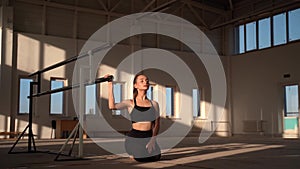 Talented gymnast sitting on the floor