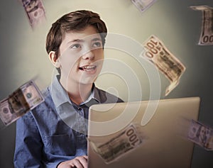 Talented successful ambitious teenager boy with laptop freelance