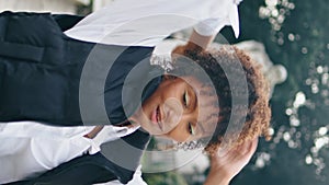 Talented woman performer dancing in park practicing freestyle closeup vertically