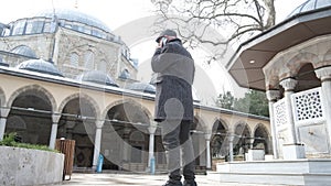 Talk On Phone In Coutyard Mosque