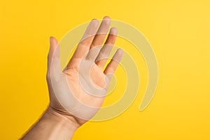 Talk to the Hand hand gesture on yellow background