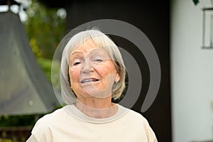 Talkative senior woman having a conversation with the viewer