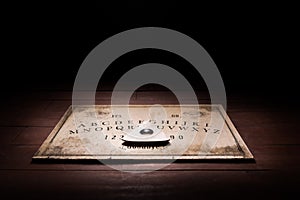 Talking board and planchette photo