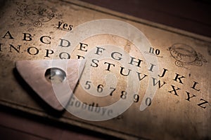 Talking board and planchette photo