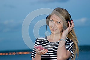 Talking on the phone on the background of the river at night