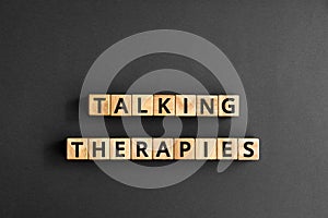 Talking therapies - word from wooden blocks with letters photo