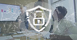 Talking three team reviewing sales on screen in office using papers, shield overlay, yellow blazer