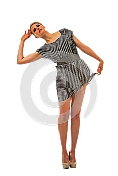 Tall blond woman holding the hem of her dress