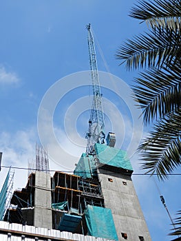 Tall blue tower crane