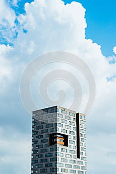 Tall building against a cloudy sky