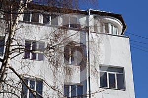 A tall building with a clock on its side
