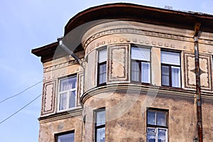 A tall building featuring a large clock on its side