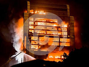 Tall building on fire / big fires burnning